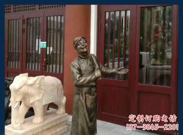 南京铜雕店小二酒店迎宾人物雕塑