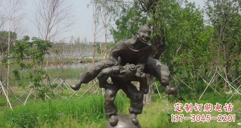 南京园林站在球上面跳山羊的人物景观铜雕