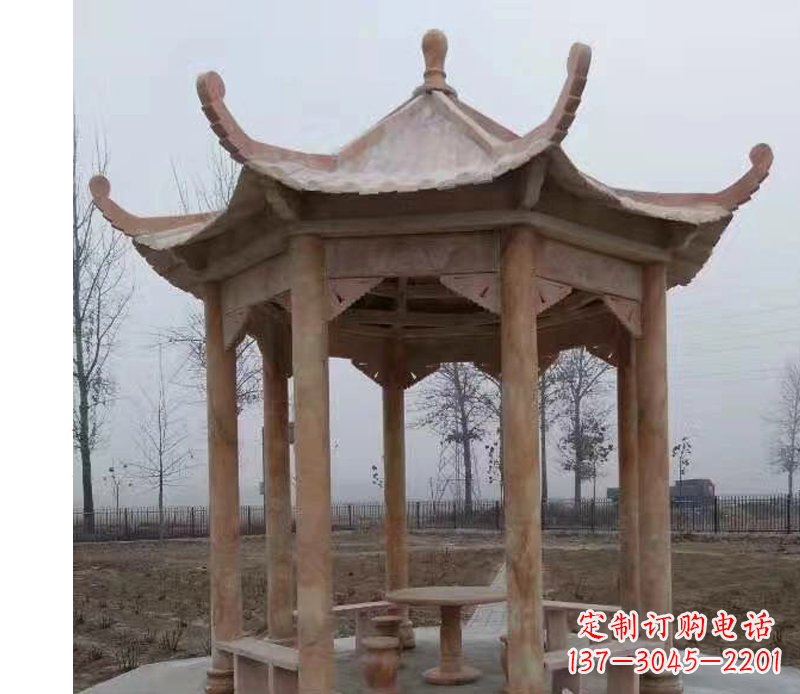南京公园晚霞红八角石雕凉亭